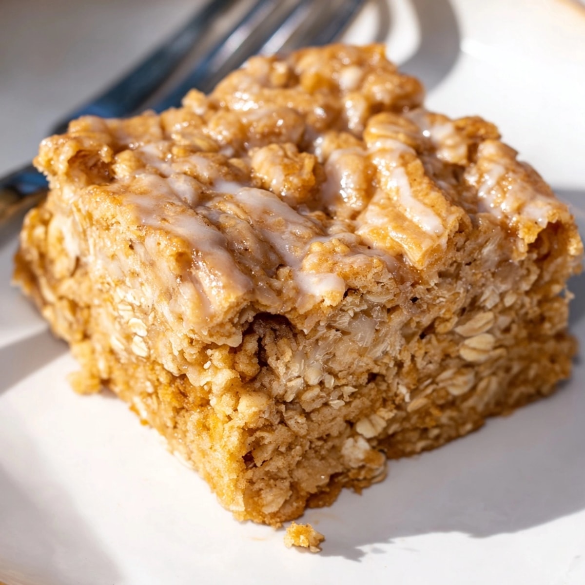 Golden-brown Cinnamon Swirl Oatmeal Blondies, baked to perfection and ready to serve.