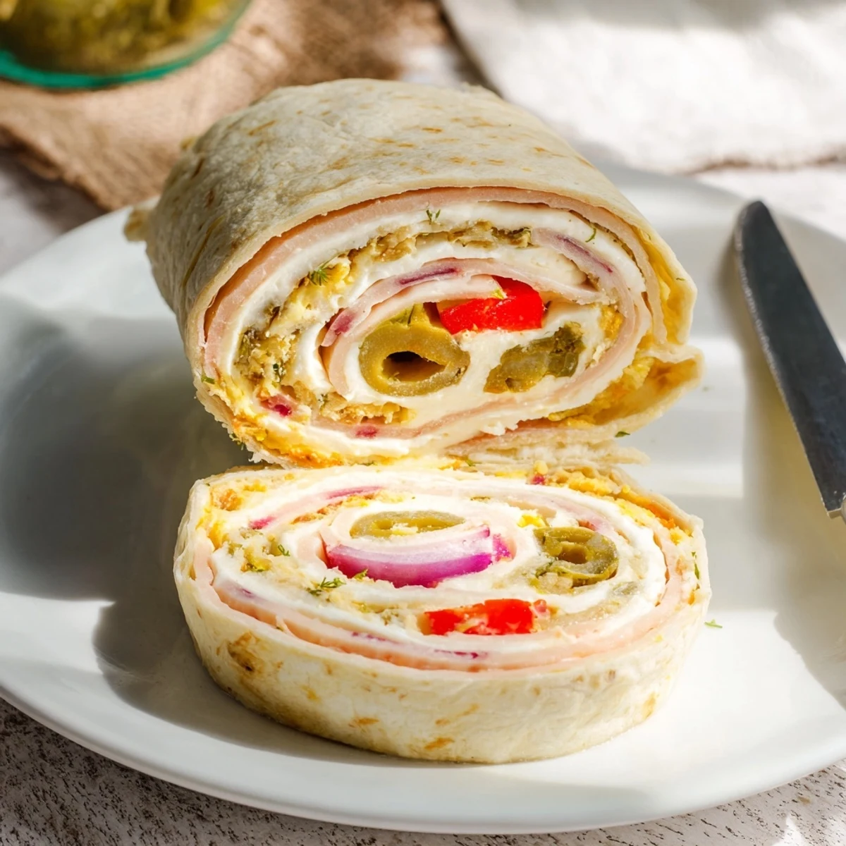 Savory Pickle-in-a-Blanket rolls, perfect for parties with a burst of flavor.