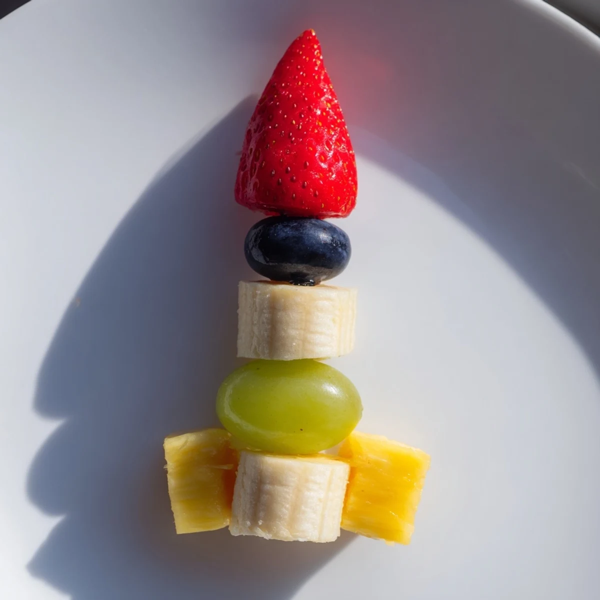 Rocket ship fruit skewers, a colorful arrangement of fresh fruit, ready to be enjoyed.