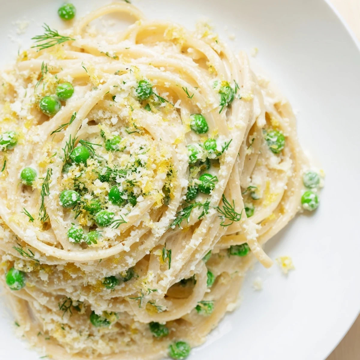 Golden Creamy Dill Pasta with bright green herbs, perfect for a cozy, comforting, vegetarian dinner idea.