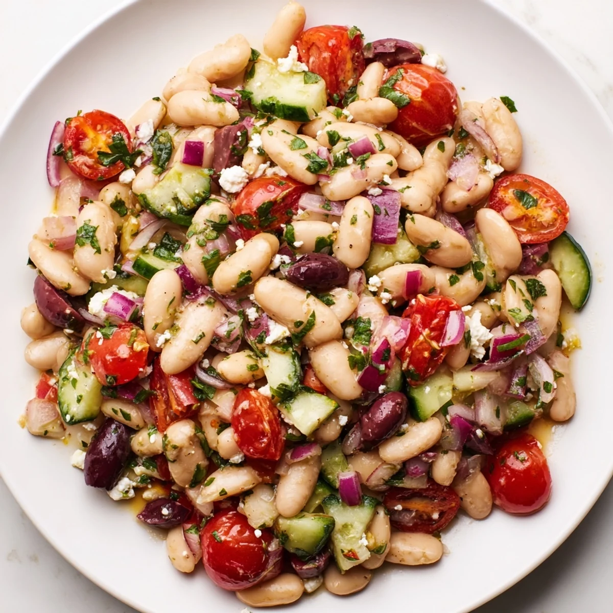 Mediterranean white bean salad, perfect as a side, with a bright, zesty olive oil dressing.