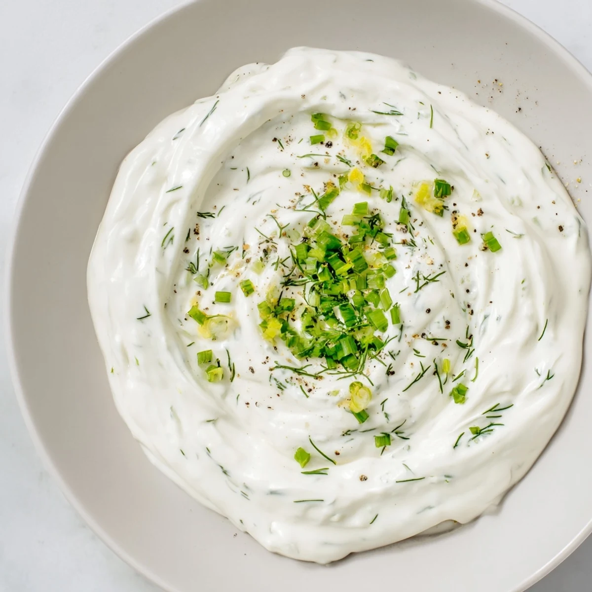 Cool, refreshing bowl of Greek Yogurt Ranch Dip, perfect for a flavorful, low-carb snack or topping.