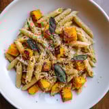 This Brown Butter Pasta with Butternut Squash showcases al dente pasta with toasted sage and Parmesan cheese.