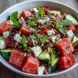 Juicy watermelon feta salad with crunchy pistachio dukkah and fresh mint topping.