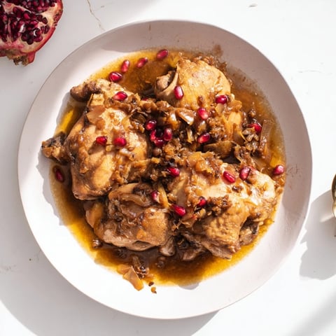 Budget Fesenjan Stew with succulent chicken thighs coated in a rich, dark sauce, ready for serving.