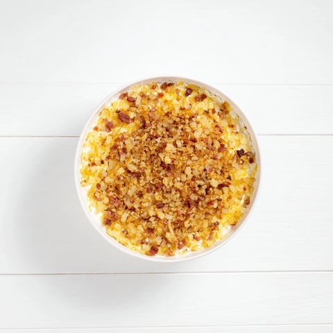 Golden caramelized onion and bacon dip, a creamy appetizer, ideal for dipping chips.