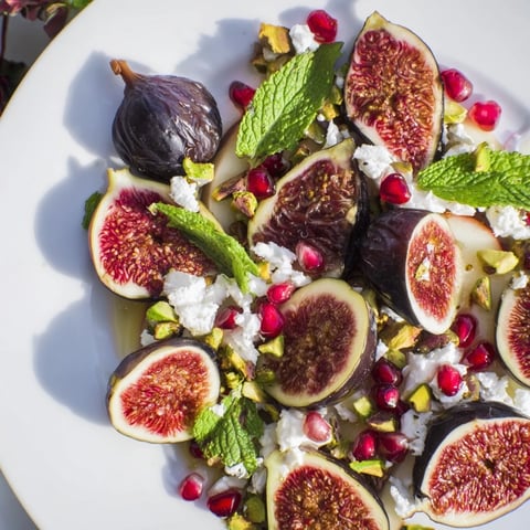 A colorful Winter Fruit: Fig and Date Snowdrift Platter boasts figs, dates, and a snowy coconut topping.