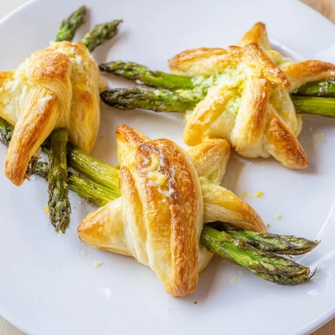 Golden-brown Star Shaped Asparagus Bundle Wraps, a flavorful appetizer, ready to serve warm.