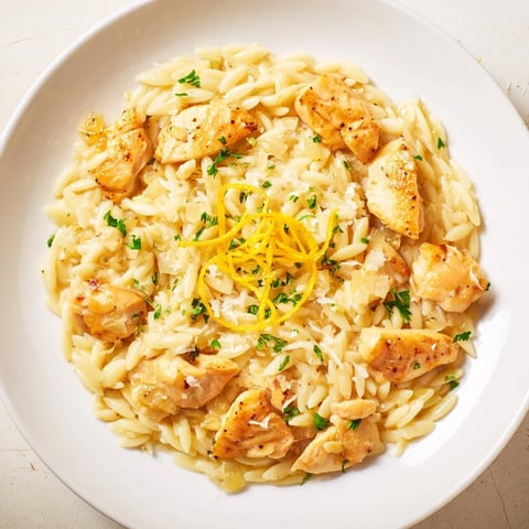 Creamy Lemon Chicken Orzo with tender chicken and bright lemon, a comforting one-pan meal's inviting aroma.