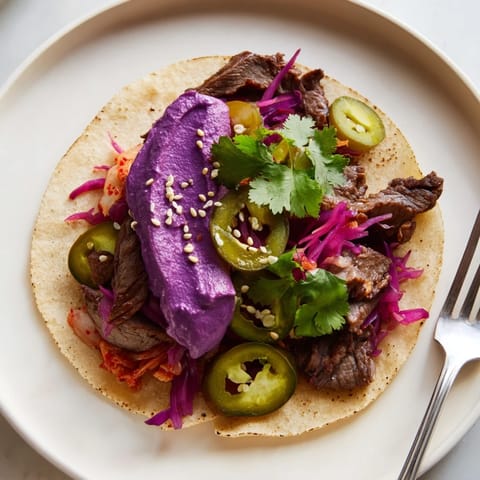 Delicious Global Street-Food Fusion Bowls filled with savory marinated protein and colorful toppings.  