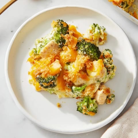Creamy Chicken & Broccoli Cheddar Bake with a golden, crispy topping ready for dinner.  