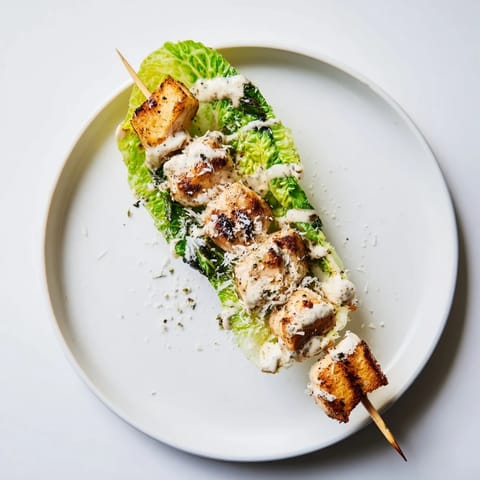Delicious Chicken Caesar Salad Skewers ready to be enjoyed, perfect for a party appetizer or easy lunch.