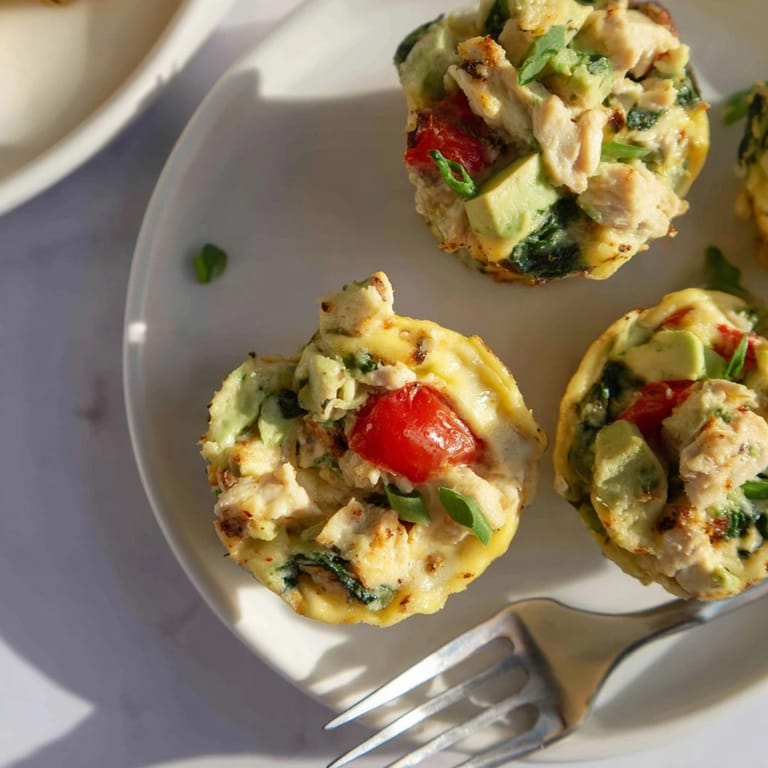 Warm, satisfying Avocado Ranch Chicken Egg Cups, a baked keto-friendly breakfast delight.