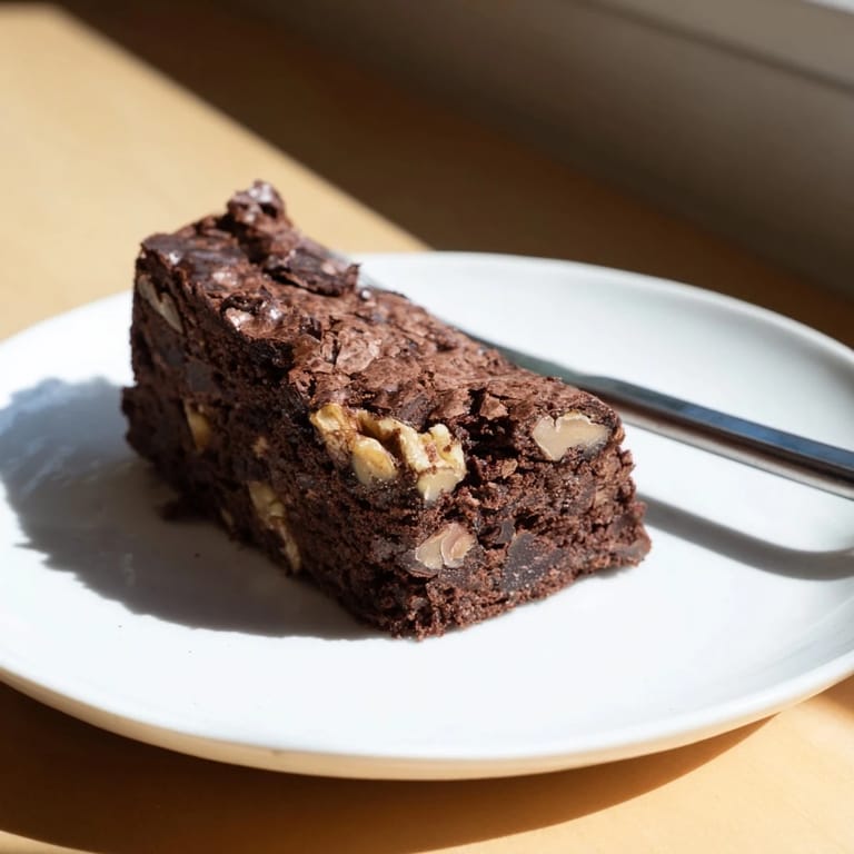 Fudgy zero-waste brownies using nut-milk pulp, served warm with vanilla ice cream.  