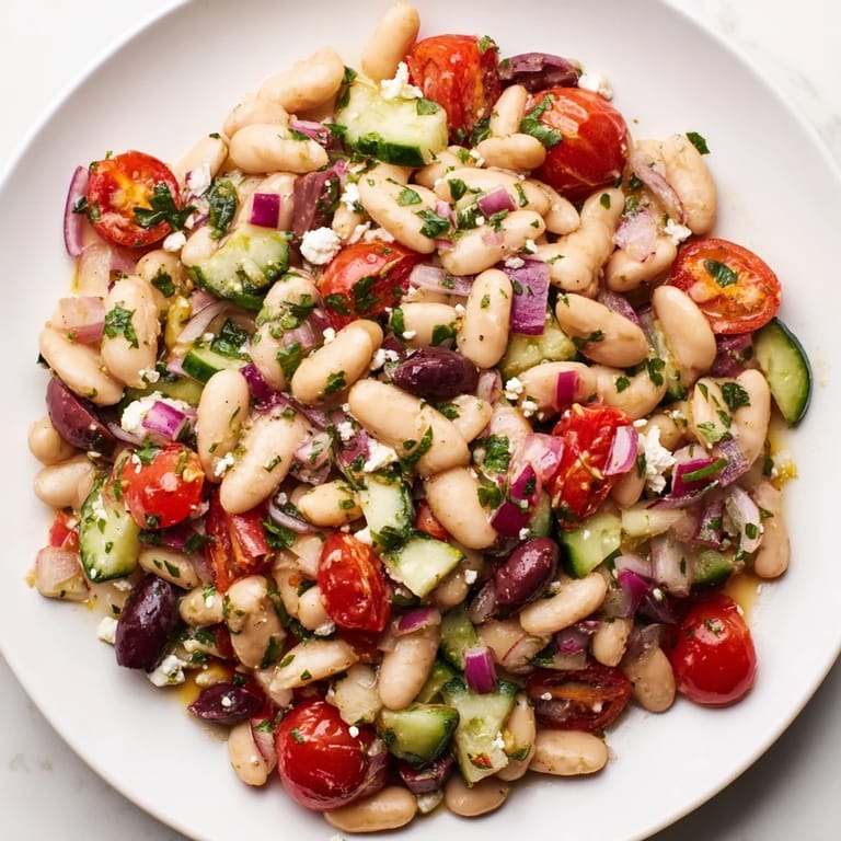 Mediterranean white bean salad, perfect as a side, with a bright, zesty olive oil dressing.