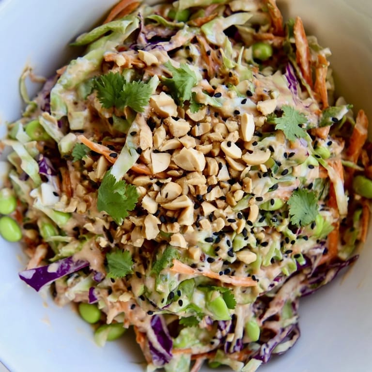 Colorful medley of veggies in Crunchy Thai Peanut Salad, tossed in a tangy peanut dressing, ready for a light meal.