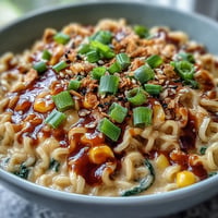 Spicy creamy corn buldak ramen with vibrant corn, ready to be devoured.